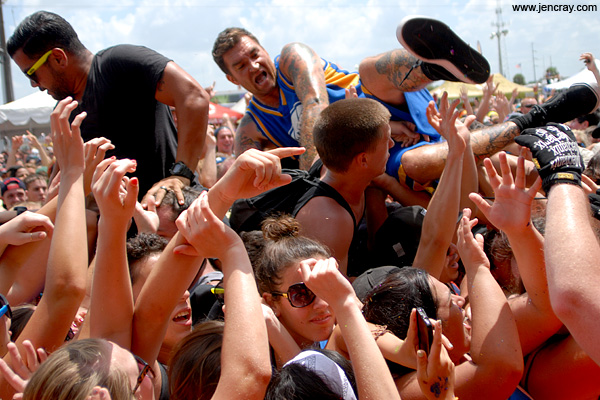 New Found Glory's Jordan Pundik hops into the crowd.